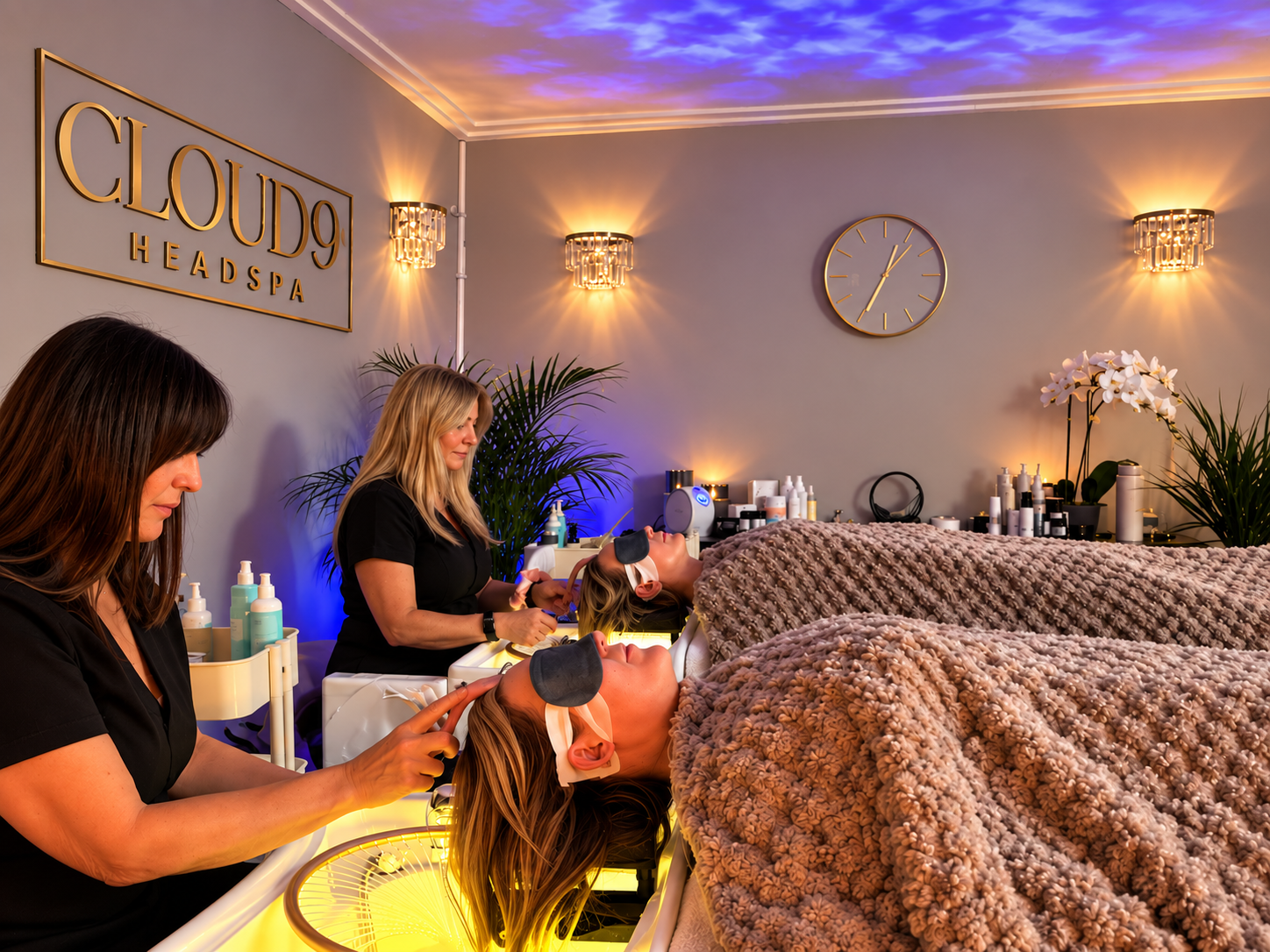 Two guests receiving head spa treatments at Cloud 9 Head Spa
